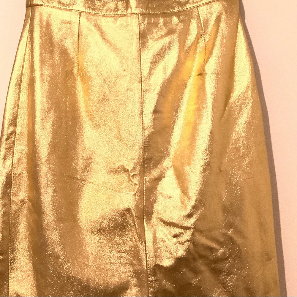 Mid length gold skirt.